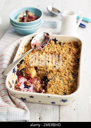 Apple and grape crumble bake in pie dish Stock Photo
