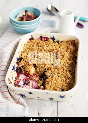 Apple and grape crumble bake in pie dish Stock Photo