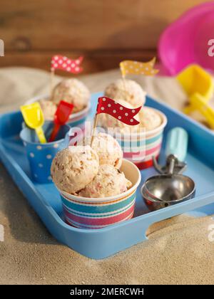 Scoops of frozen yogurt in tubs Stock Photo