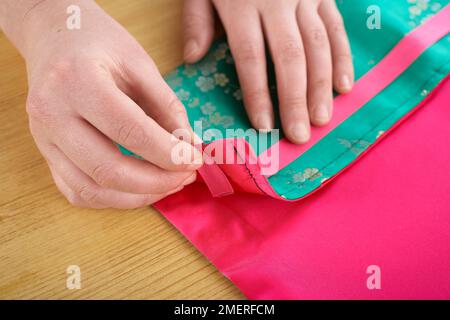 Thai silk manicure roll, fold the top stitched edge Stock Photo