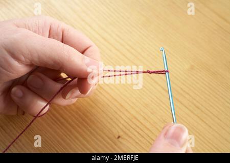Making crochet necklace, Making a slip knot Stock Photo