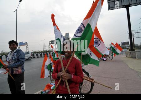 January 24, 2023, Delhi NCR, Ghaziabad, Uttar Pradesh, India: National Flag sale on Road on the forthcoming Republic day, buying by Girls in International Girl Day on the eve of Indian Republic day. (Credit Image: © Ravi Batra/ZUMA Press Wire) EDITORIAL USAGE ONLY! Not for Commercial USAGE! Stock Photo