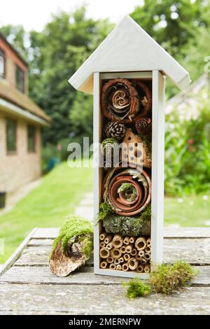 Insect hotel in garden Stock Photo