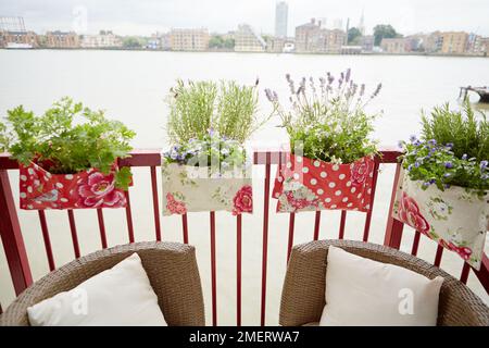 Saddle bag style balcony planters Stock Photo