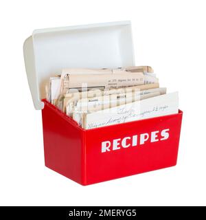 1950s vintage Mid-Century Modern red and white plastic Lustroware recipe box for collecting family recipes and newspaper clippings. Stock Photo