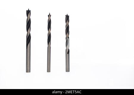 Drill bits of different sizes isolated on white background and copy-space Stock Photo
