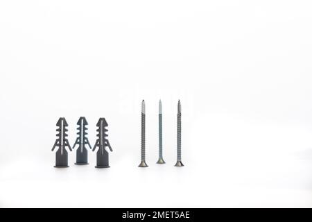 Screws and dowels isolated on white background with copy-space Stock Photo