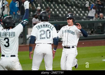 Seattle Mariners' J.P. Crawford (3) is greeted by Ty France after Crawford  scored in the eighth inning of the team's baseball game against the Los  Angeles Angels, Friday, April 30, 2021, in