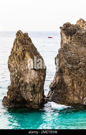 Boulders in the turquoise green sea, Monterosso al Mare, Cinque Terre, Ligurian Coast, Liguria, Italy Stock Photo