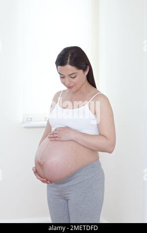 Heavily pregnant woman Stock Photo