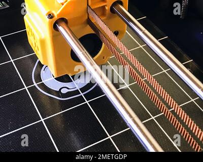 printer 3d device with numerically controlled machine,along the rails of the head extruder,prints creates models details of a figure made of polymer p Stock Photo