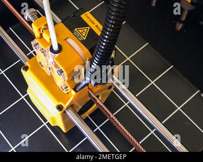 printer 3d device with numerically controlled machine,along the rails of the head extruder,prints creates models details of a figure made of polymer p Stock Photo