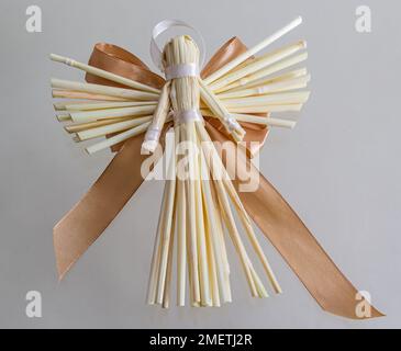 Tradition angels from handmade straw. National traditions of Ukraine.Christmas angel. Christmas straw ornament isolated on white background. Happy New Stock Photo