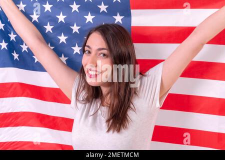 Caucasian woman smiling with usa flag isolated on a white background, closeup Stock Photo