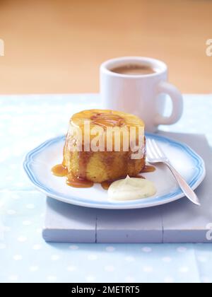 Pineapple upside down cake with basil cream, cup of coffee Stock Photo