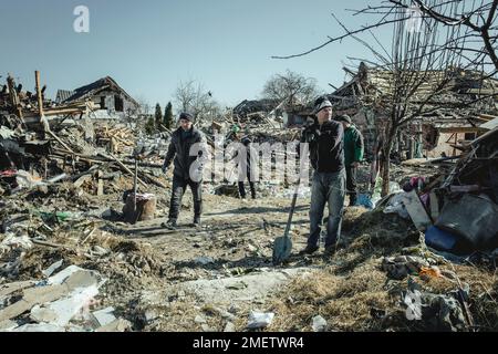 Cleaning up the ruins of the Bohunia residential neighbourhood, it was destroyed by a Russian missile attack on the night of 1 to 2 March 2022, the Stock Photo