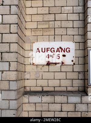 Signpost on the facade of an old factory, Berlin, Germany Stock Photo