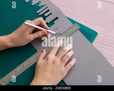 Paper Craft. DIY Concertina City Card Step 5 Stock Photo