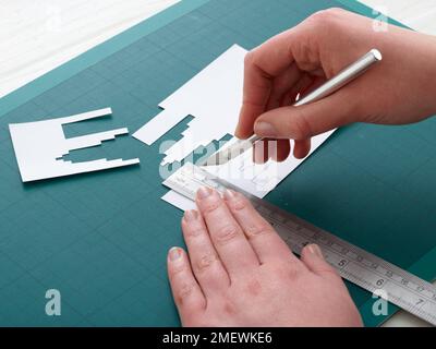 Paper Craft. DIY Concertina City Card Step 1 Stock Photo