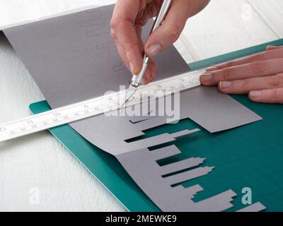 Paper Craft. DIY Concertina City Card Step 5 Stock Photo