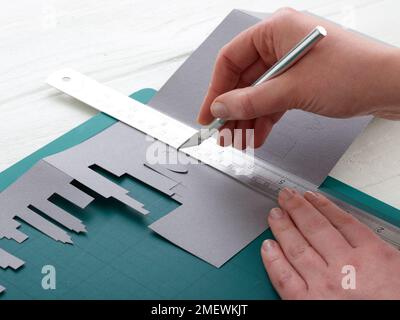 Paper Craft. DIY Concertina City Card Step 5 Stock Photo