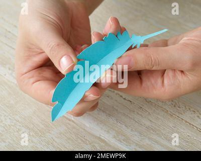 Papercraft Paper feather gift wrap Stock Photo