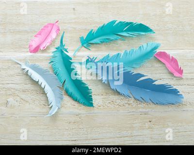 Papercraft Paper feather gift wrap Stock Photo