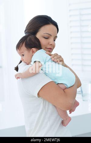 Winding positions, baby over shoulder. Stock Photo