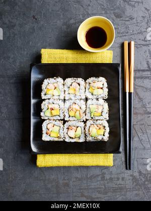 Spicy crayfish with avocado and mango inside-out sushi rolls Stock Photo