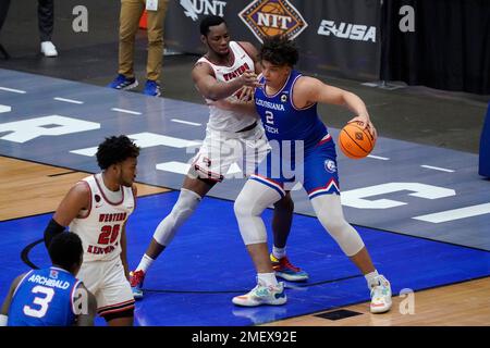 Louisiana Tech forwards Kenneth Lofton, Jr. (2) and Andrew Gordon (33)  celebrate a win over Mississippi after an NCAA college basketball game in  the NIT, Friday, March 19, 2021, in Frisco, Texas. (