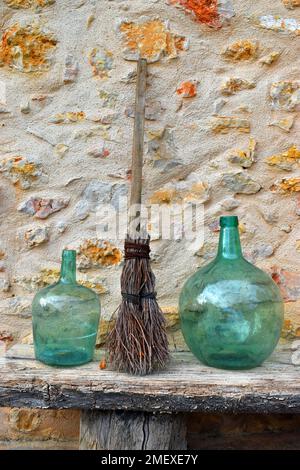 Rustic decoration with glass vases and a briar broom Stock Photo
