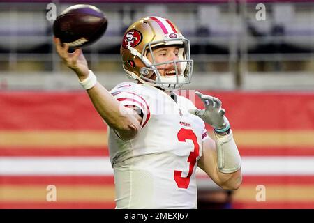 FILE - San Francisco 49ers quarterback Steve Young upends Dallas