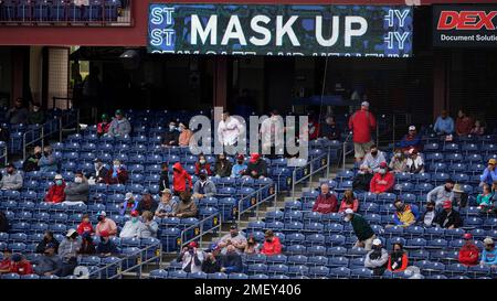 Socially distanced baseball fans watch a spring training