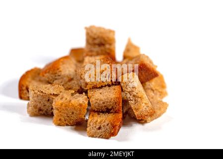 Toasted bread cubes against white background Stock Photo