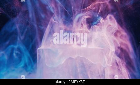 Glitter mist ice cube neon smoke color light steam Stock Photo