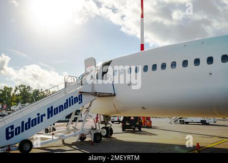 Kerkyra, Greece - 09 29 2022: View in Corfu Airport On White Nose of Boeing in Sunny Weather. Plane Is Ready For Boarding Passengers. Stock Photo