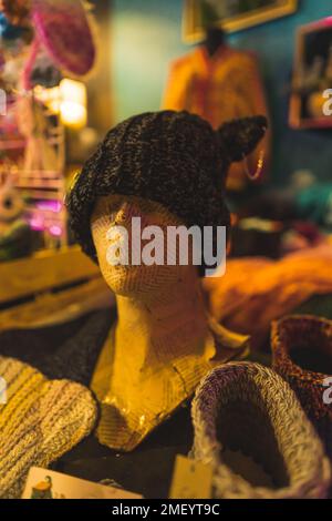 Makers market stall with knitt cap on head mannequin. High quality photo Stock Photo