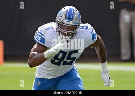 Green Bay Packers defensive end Dean Lowry (94) is blocked by Detroit Lions  offensive tackle Penei Sewell (58) during the first half of an NFL football  game Sunday, Nov. 6, 2022, in