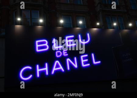 Bleu de Chanel neon logo against dark background Stock Photo