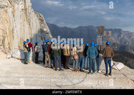 Group of visitors on tour of Carrara marble quarry, UNESCO World Heritage Site,  in Massa and Carrara, Italy, Europe. Stock Photo