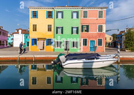 Colorful houses along a canal in Burano, a small island in the Venetian Lagoon, 9km north of Venice, Italy. Stock Photo