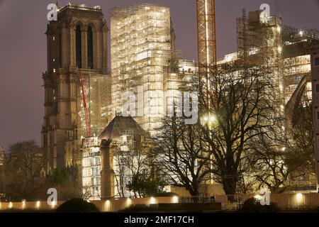 Paris, Ile de France, FRANCE. 24th Jan, 2023. The scaffolding around Notre Dame Cathedral is bathing in light as work on the fire damaged building continues to make sure it is ready for the Paris 2024 Olympic games. French president Emmanuel Macron, has put his politcal weight and personal assurance behind the time frame renovation. The Cathedral was damaged during a fire on April 15th 2019, creating worldwide worry. (Credit Image: © Remon Haazen/ZUMA Press Wire) EDITORIAL USAGE ONLY! Not for Commercial USAGE! Credit: ZUMA Press, Inc./Alamy Live News Stock Photo