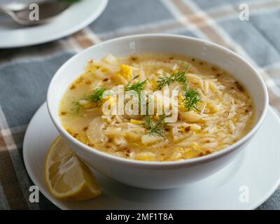 Bowl with a home made lemony fennel soup with orzo. Stock Photo
