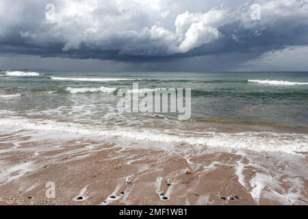 Storm clouds over Whitepark Bay, Ballintoy, Co. Antrim, Northern Ireland Stock Photo