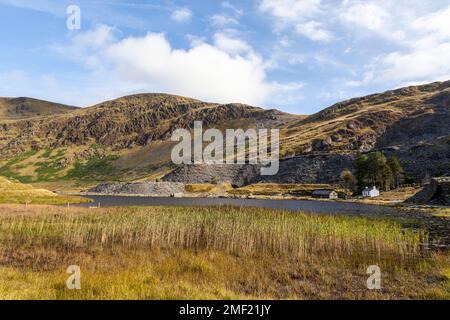 Looking across Llyn Cwmorthin towards the disused slate quarry of Cwmorthin, a popular place for hikers to explore, Snowdonia National Park Stock Photo