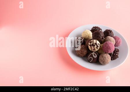 photo different candies lying on a plate on a colored background Stock Photo