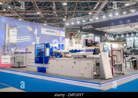 Electric hydraulic toggle injection molding machine at plastic exhibition Stock Photo