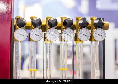 Flowmeter, rotameter - flow regulator for cooling system of injection machine Stock Photo