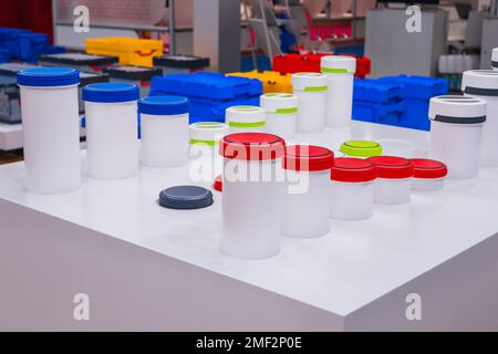 Many colorful plastic boxes, containers, crates at storage exhibition Stock Photo