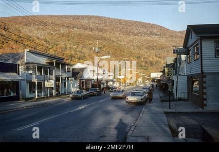 Street in Phoenicia with wooden buildings and shops. Phoenicia, Shandaken, Ulster County, New York, USA,1965 Stock Photo